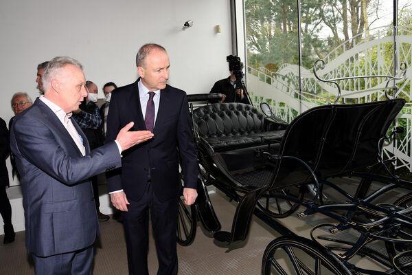 Carriage of sale: An Tánaiste, Micheál Martin, T.D. pictured with Mark Whitaker , CEO of JPMG Motor Group at the do<em></em>nation of  a carriage from the original Johnson &amp; Perrott garage in Emmet Place, Cork with other artifacts to Cork Public Museum in Fitzgeralds Park. Picture: Adrian O'Herlihy