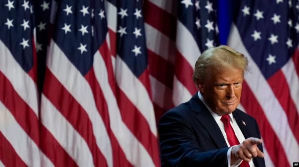 Republican presidential nominee former President Do<em></em>nald Trump points to the crowd at an election night watch party, Nov. 6, 2024, in West Palm Beach, Fla.